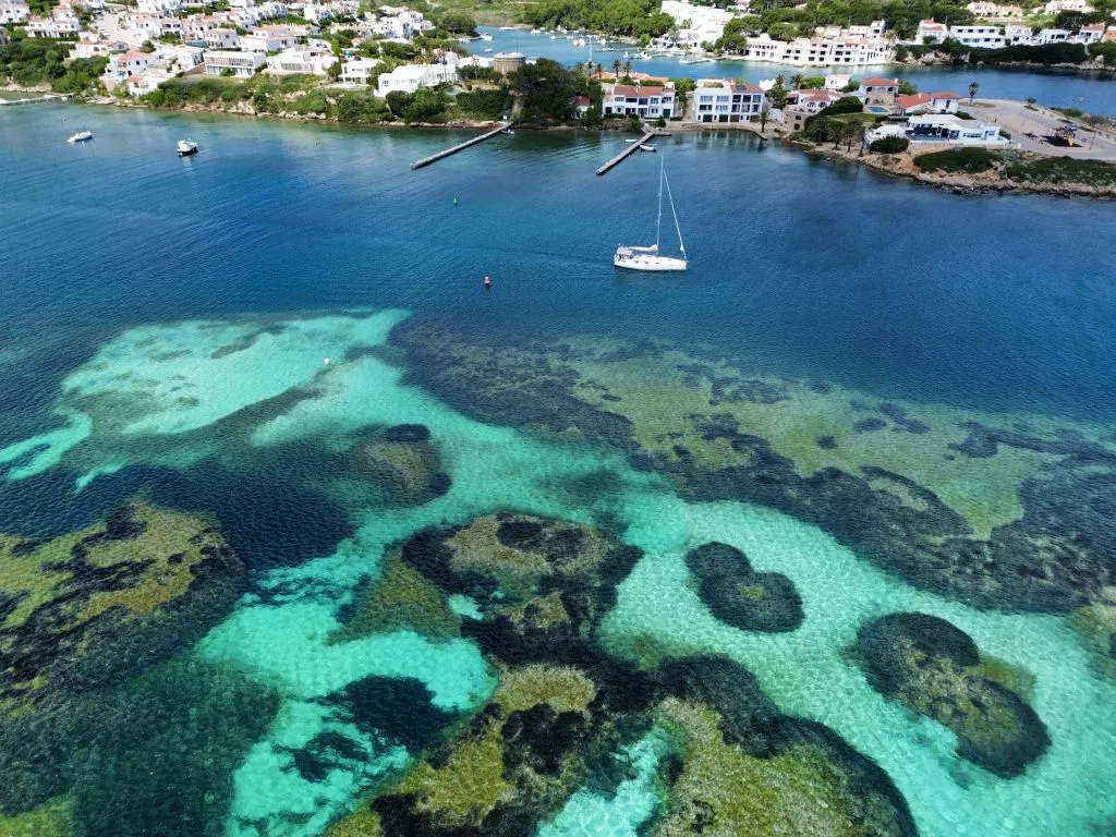 Boat floating through special places in Menorca
